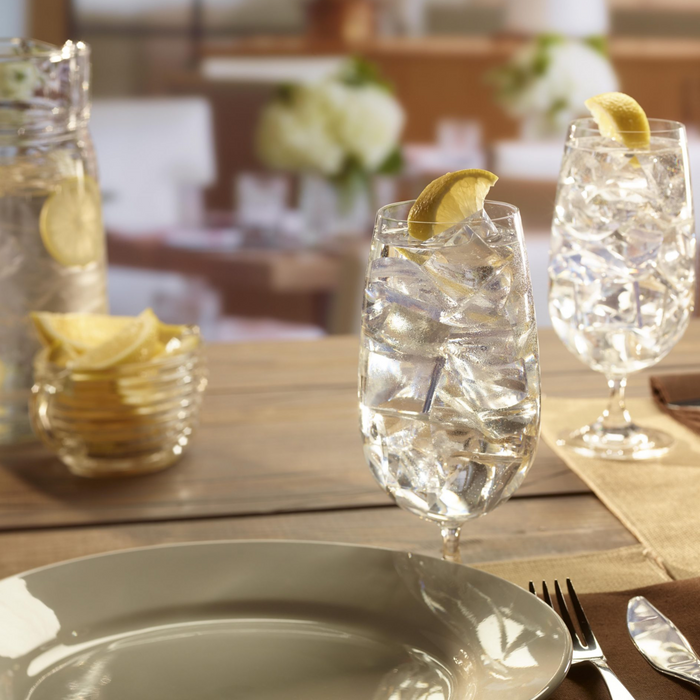 Hoshizaki crescent ice cubes in glasses with lemon slices, restaurant setting.