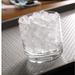 Glass filled with cubelet ice on a tray, produced by the Hoshizaki FD-650MRJZ-C Icemaker.